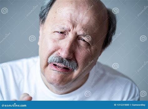 Close Up Portrait Of Sad Old Man Face Suffering From Depression Stock