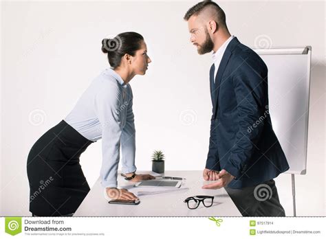 Business People Having Disagreement And Looking At Each Other In Office