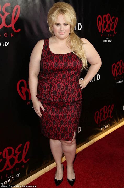 Rebel Wilson Wears A Scarlet And Black Peplum Dress At Launch Of Her