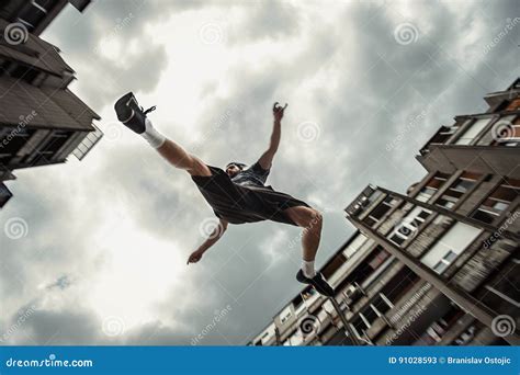 Young Man Doing Parkour Jump In The City Stock Image Image Of Concept