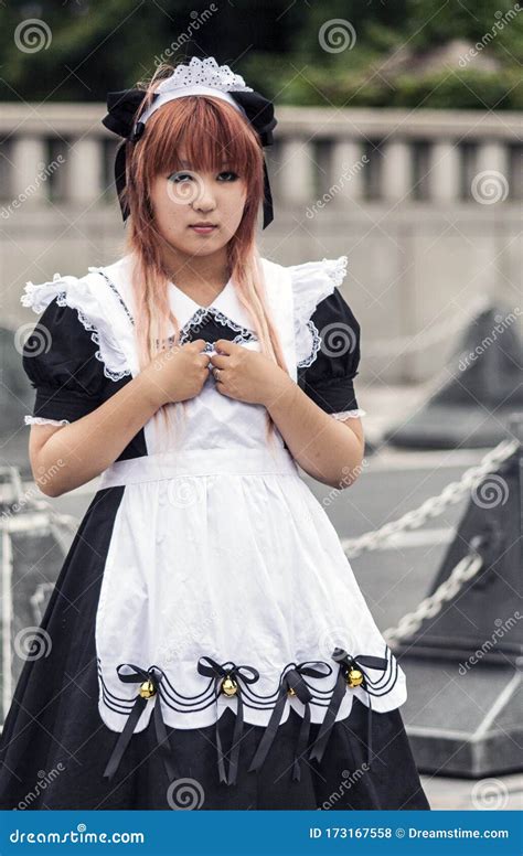 Shy Teenage Cosplay Girl Wearing Maid Outfit In Harajuku Editorial Image