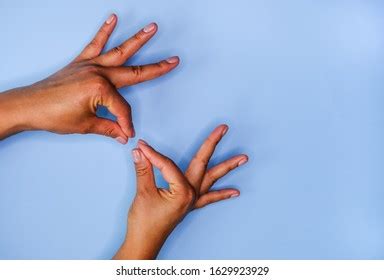 Womans Hands Nude Manicure On Blue Stock Photo Shutterstock