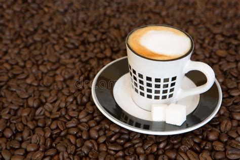 Single Small Coffee Cup On Coffee Beans Background Stock Photo Image