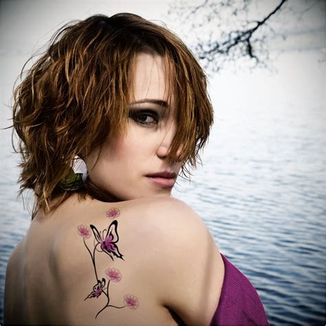 Cute And Feminine Butterfly Tattoos For Women On Shoulder Blade