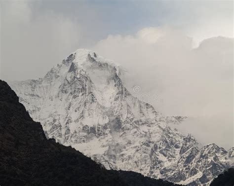 Manaslu Mountain With Snowy Peaks In Clouds On Sunny Bright Day In