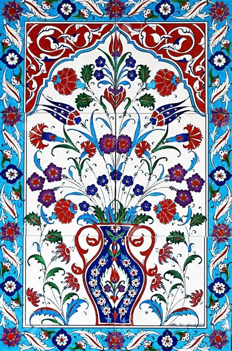 An Intricately Decorated Tile With Flowers And Birds In Blue Red And