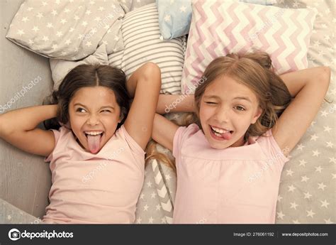 Slumber Party Timeless Childhood Tradition Girls Relaxing On Bed