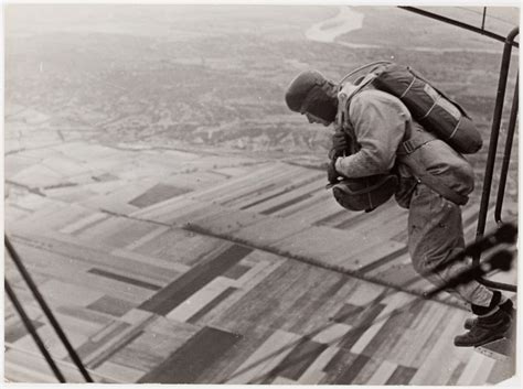 French Air Force Parachute Parachutist Jumping From A Plane At