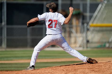 Baseball Pitcher Throwing The Ball Stock Photo Download Image Now