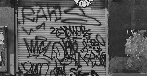 Grayscale Photo Of Graffiti Art On The Wall · Free Stock Photo