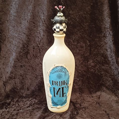 alice in wonderland drink me ceramic bottle