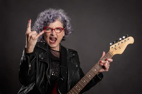 Premium Photo Portrait Of Beautiful Old Woman Playing Electric Guitar