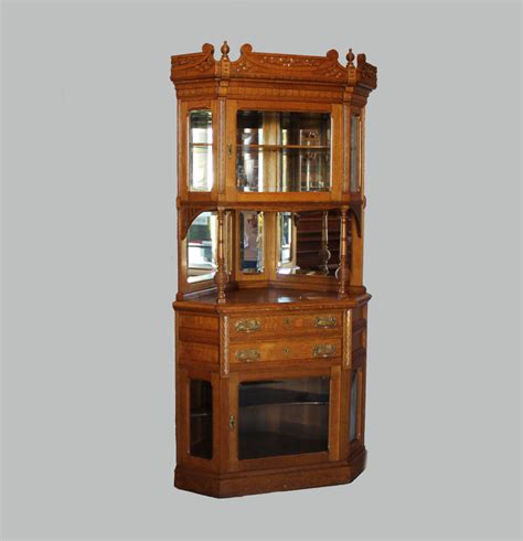 The corner curio cabinet enhances the decor of your home, protect and display your art and collectibles. Bargain John's Antiques | Victorian Two Piece Oak Corner ...