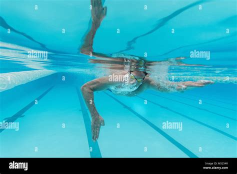 Underwater View Of Olympic Swimmer Training In Pool Hi Res Stock