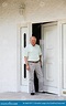 Retired Man in the Doorway of His Home Stock Image - Image of male ...