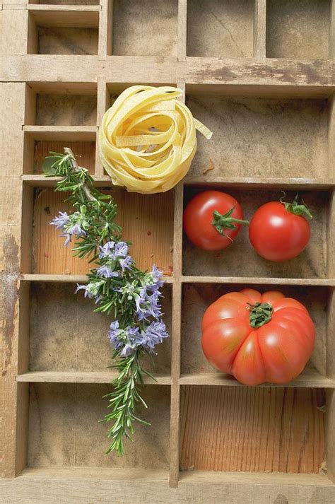 Ribbon Pasta Tomatoes And Rosemary In Type Case Photograph By