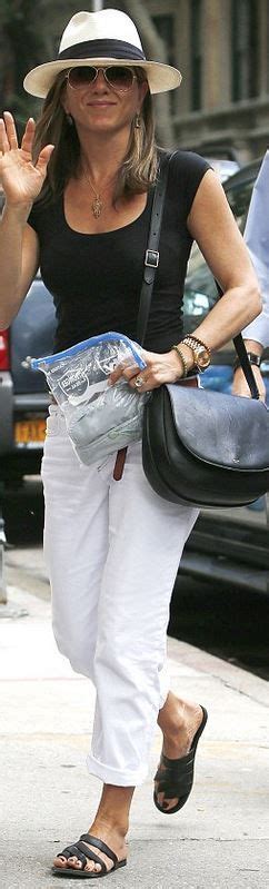 Who Made Jennifer Anistons Leather Handbag Black Flat Sandals And