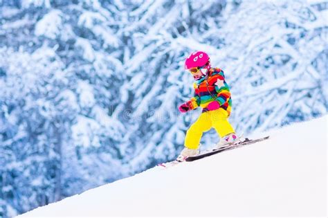 Little Girl Skiing In The Mountains Stock Photo Image Of Baby Helmet