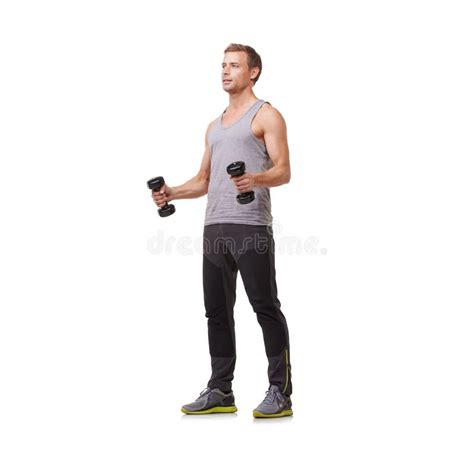 Strengthening His Arms Full Body Of A Fit Young Man Doing Bicep Curls
