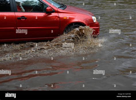 Car Rides In Heavy Rain On A Flooded Road Stock Photo Alamy