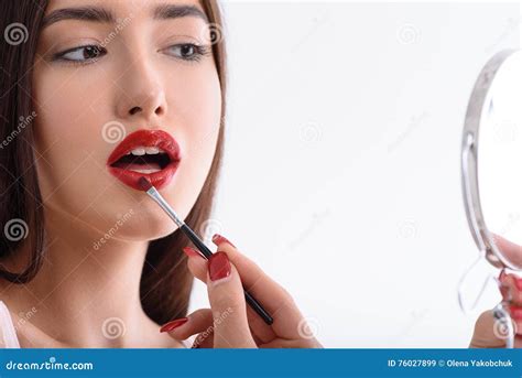 Attractive Woman Applying Red Lipstick Stock Image Image Of Beautiful Attractive 76027899
