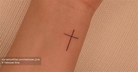 Minimalist Cross Tattoo On The Wrist