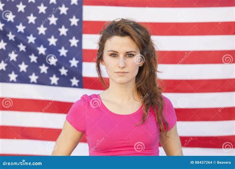Portrait Of A Caucasian American Woman Isolated On A Usa Flag Stock
