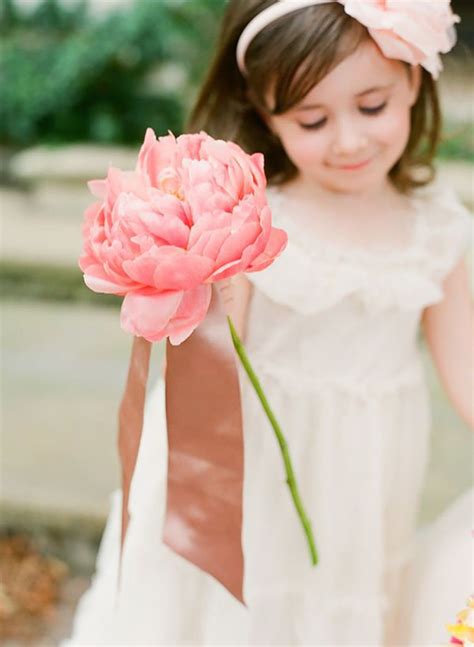 Flower Girl Holding A Large Pink Flower Flower Girl Basket