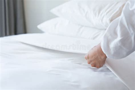 Female Hand Set Up White Bed Sheet In Bedroom Stock Image Image Of