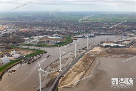 Aerial View Harbor Delfzijl With Wind Turbines And Factories In The