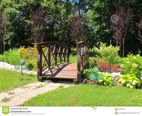 Wooden Bridge In A Colorful Garden Stock Image Image Of Brook