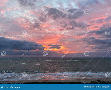 A Vibrant Sunrise Over The Atlantic Ocean Stock Photo Image Of