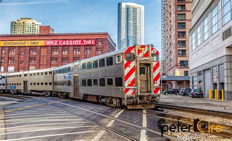 Metra Commuter Rail Train Arriving Into The Ogilvie Train Station In