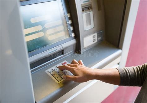Close Up Of Hand Entering Pin Code At Atm Machine Stock Photo Image
