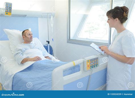 Doctor Or Nurse Talking To Patient In Hospital Stock Image Image Of