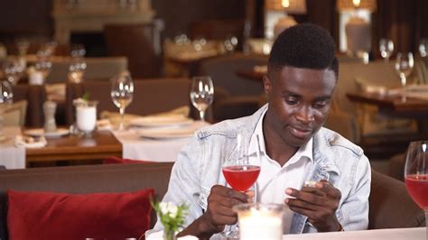 Premium Photo Black Man Drinking Red Wine In Restaurant