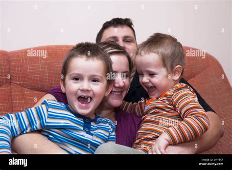 Happy Parents With Children Having Fun At Home Stock Photo Alamy