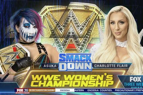 new wwe women s title belt given to asuka on 6 9 smackdown charlotte flair returns to confront