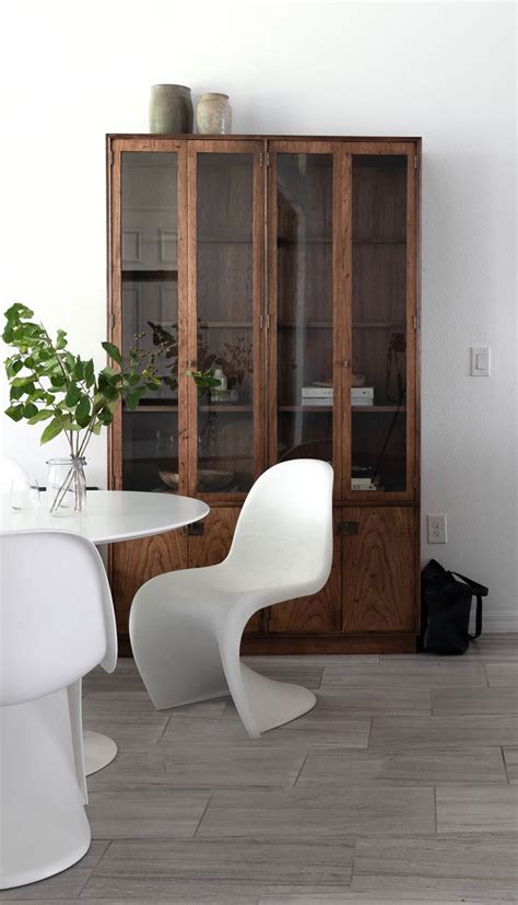 Sea shells, old clocks, holiday mementos. display cabinet in contemporary dining room #diningroom # ...