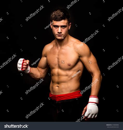 Male Model Kickboxing Located On Back Stock Photo