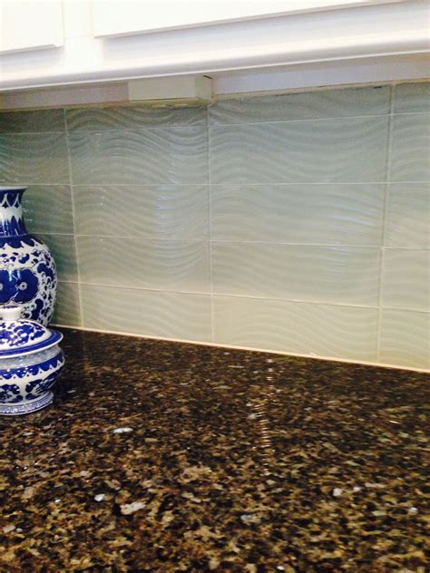 Granite Countertop With Wave Textured Glass Tile Kitchen Backsplash In