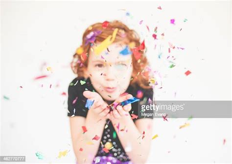 Girl Blowing Confetti Photos And Premium High Res Pictures Getty Images