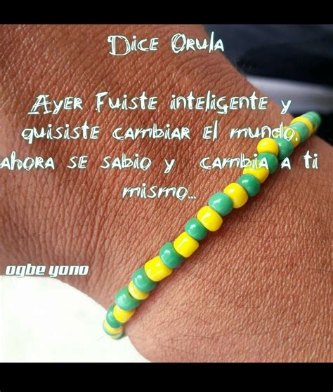 A Person Wearing A Bracelet With Yellow And Green Beads On Their Wrist