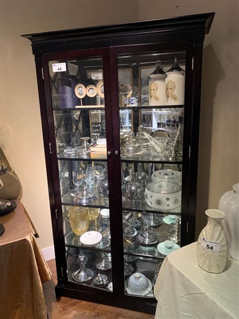 Dark Wood Cross Side 2 Door Glass Curio Cabinet With Assorted Decor