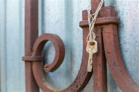 Premium Photo Old Rusty Key Hangs On The Old Fence Lost Keys And