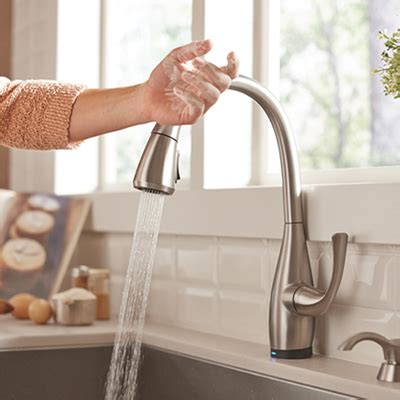 The supply lines should fit inside the bracket. How To Tighten Kitchen Faucet Nut Under Sink | Wow Blog