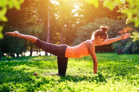 Yoga Young Woman Practicing Yoga Or Dancing Or Stretching In Nature At