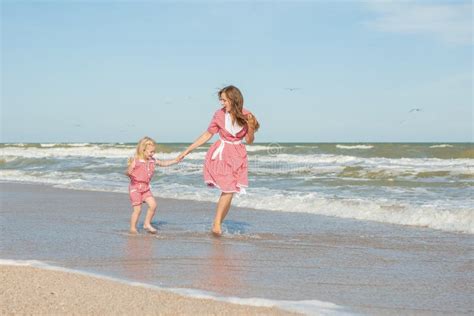 Mother And Her Daughter Having Fun On The Beach Stock Image Image Of Beautiful Joyful 60026519