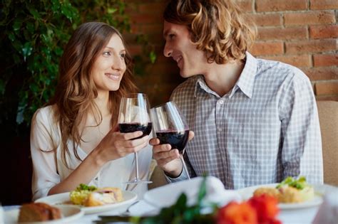 Romantic Couple Drinking Wine In A Restaurant Photo Free Download