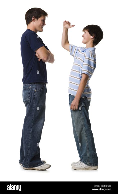 Two Brothers Comparing Height Stock Photo Alamy